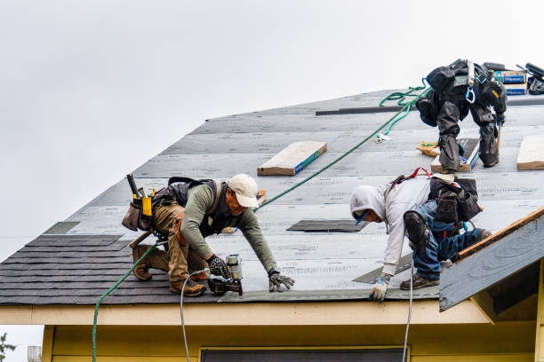 Professional Gutter Installation technician working in Locust Valley, NY